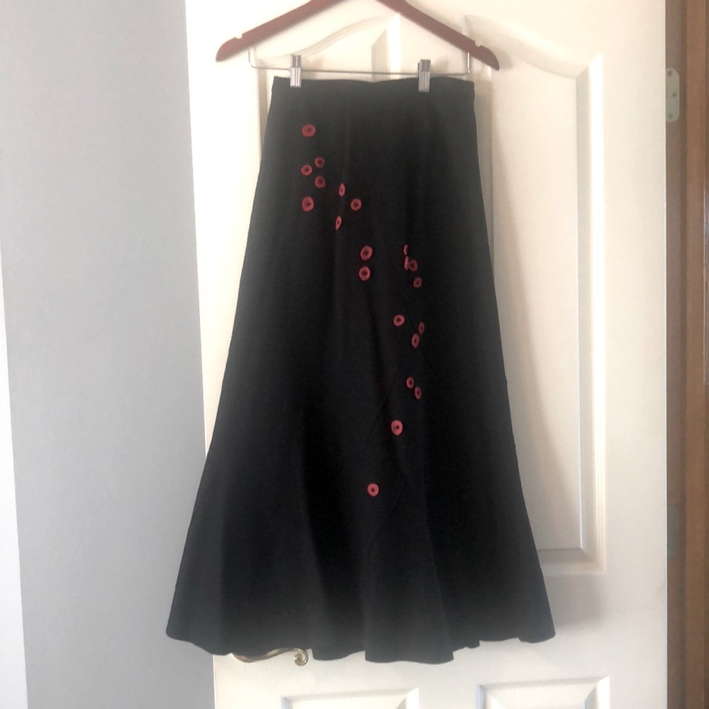 Long wool skirt with beaded flowers.